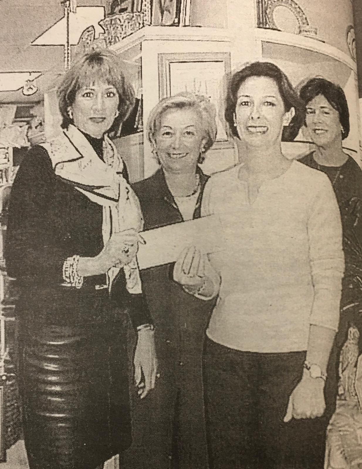 $500 check presented to winners of The Islander News $500 holiday raffle.